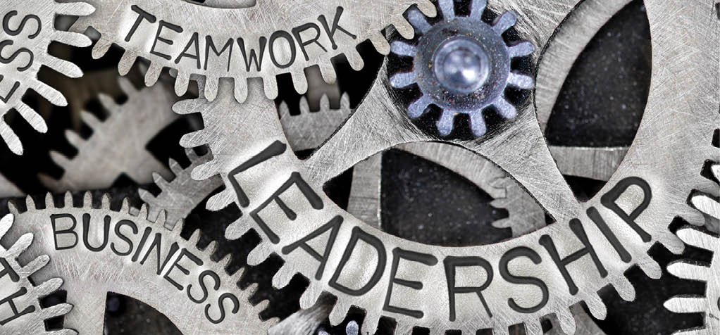 Macro photo of tooth wheel mechanism with LEADERSHIP, TEAMWORK, SUCCESS, COMPANY, GROWTH and BUSINESS concept letters