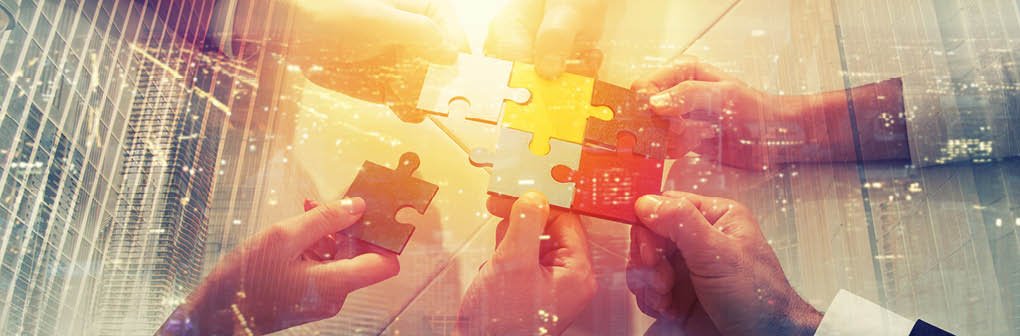 Teamwork of partners  Concept of integration and startup with puzzle pieces  double exposure